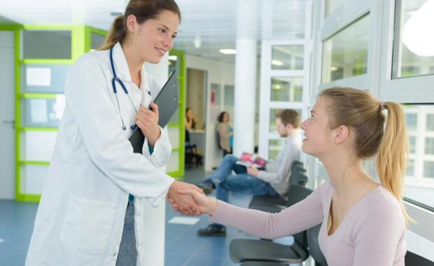 doctor speaking with patient in a small clinic