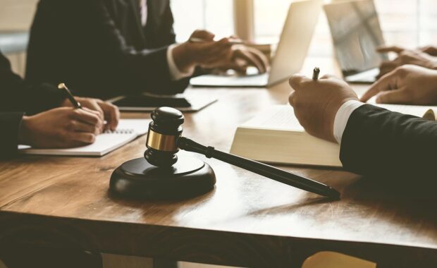 lawyers discussing contracts in a courtroom